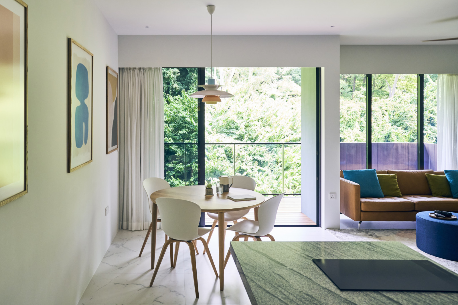 One of the three original bedrooms was removed to extend the communal zones, resulting in a spacious living and dining area with direct access to the balcony