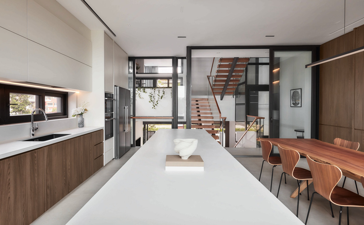 A view of the terrace house’s split levels from the kitchen and dining area
