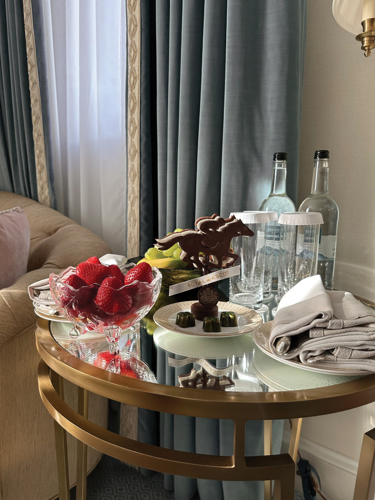 An assortment of English treats, including house-made chocolates to celebrate Ascot, and English strawberries on display