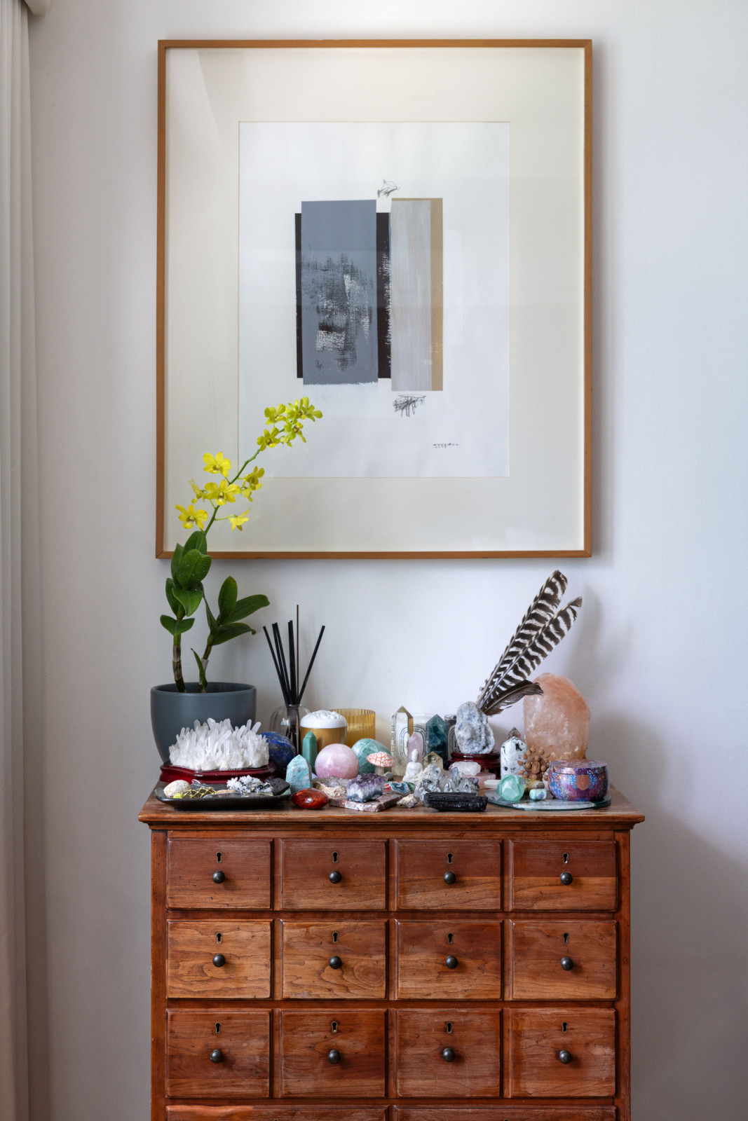 Fresh flowers, crystals and a Himalayan salt lamp at Zubiri's
“Cabinet of Good Vibes” in her home