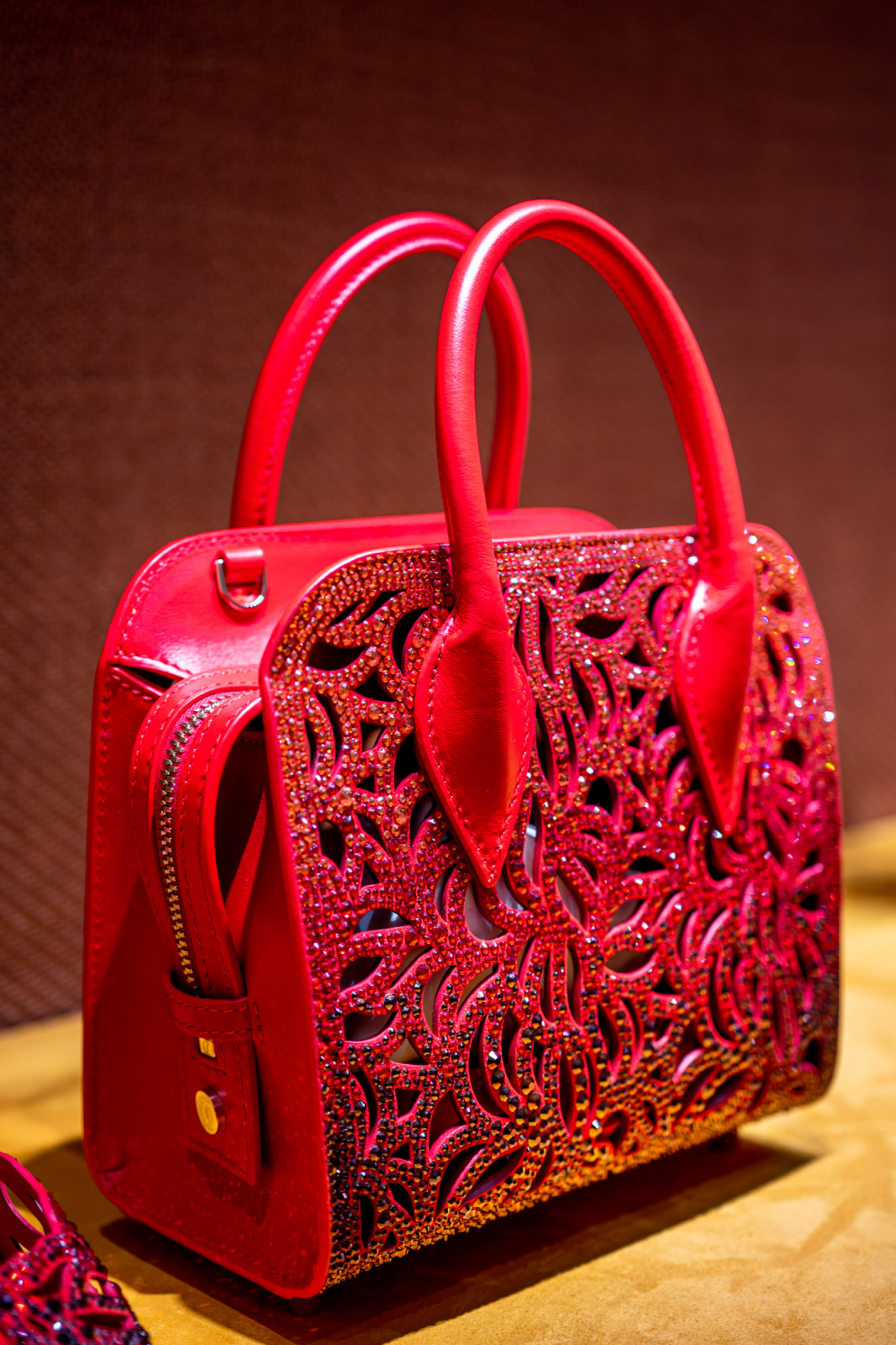 The red and sparkly Elouise top handle bag that matches the Lasera pump