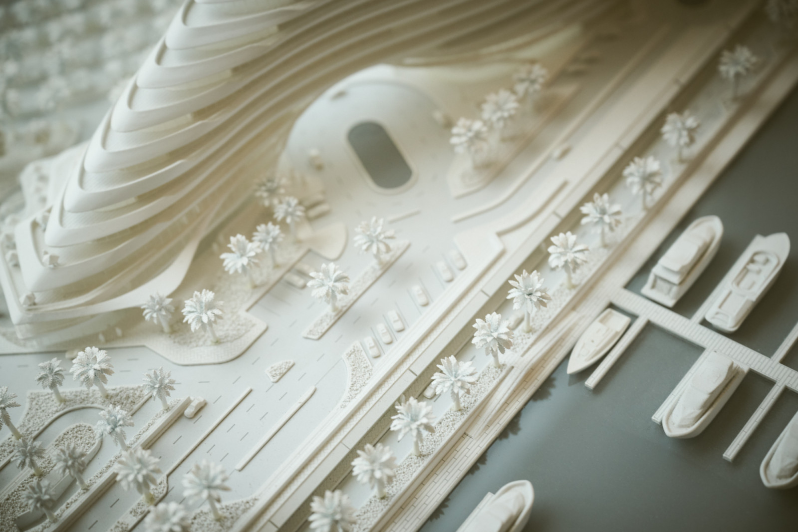 A detailed architectural model showcases the fluid, wave-like design of Jumeirah Marsa Al Arab