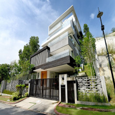 A street perspective reveals how this hillside home steps up the terrain