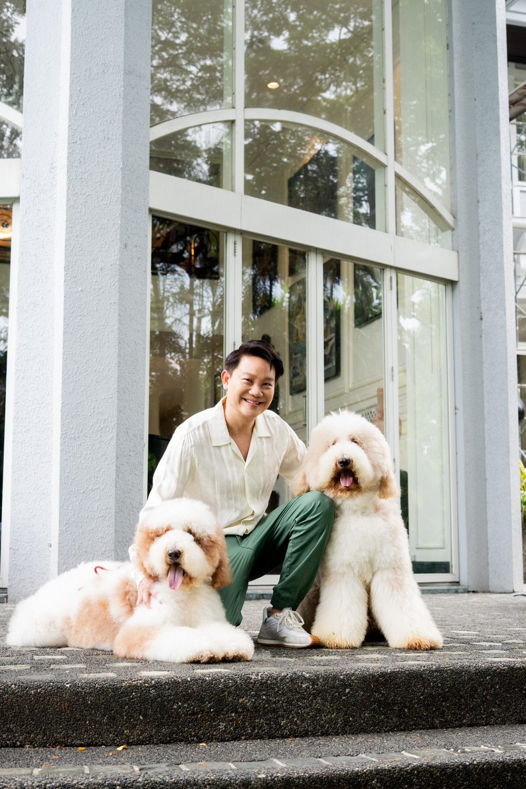 Dr Z Teo with giant poodles Paris and Berlin