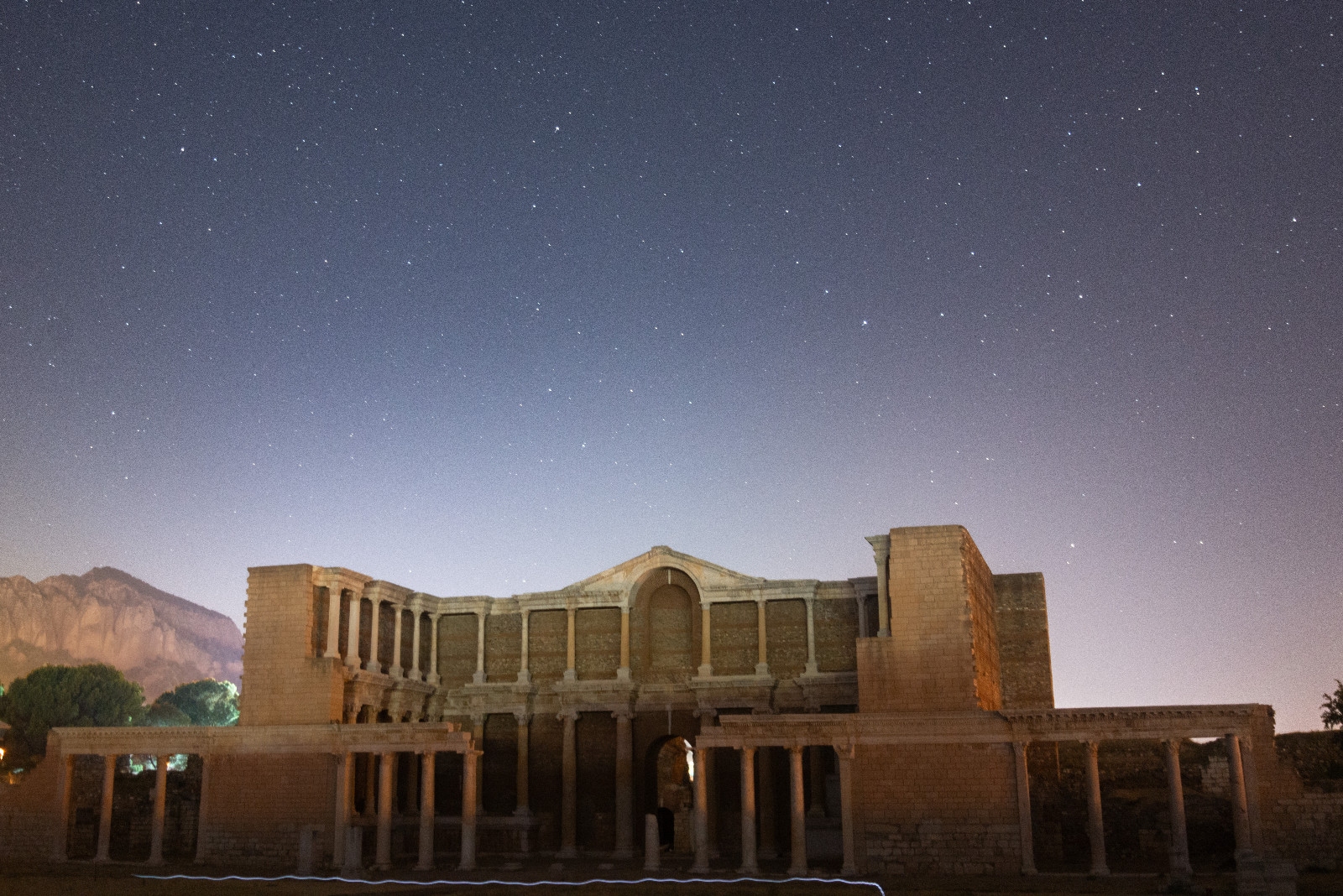 MANISA, TURKIYE - AUGUST 08: A long exposure photo shows Milky Way as starry night shining the Temple of Artemis, one of the world's most magnificent temples in the ancient city of Sardis, the capital of the Lydian Kingdom, which dates back to 1200 BC and minted the first coin in history, in Manisa, Turkiye on August 08, 2024. (Photo by Kamil Tekmen/Anadolu via Getty Images)