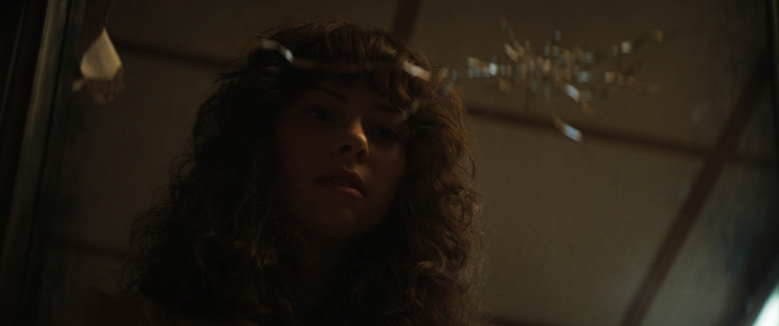 Heather Smurl looking at the mirror that started the horrors in their home in ‘The Conjuring: Last Rites’