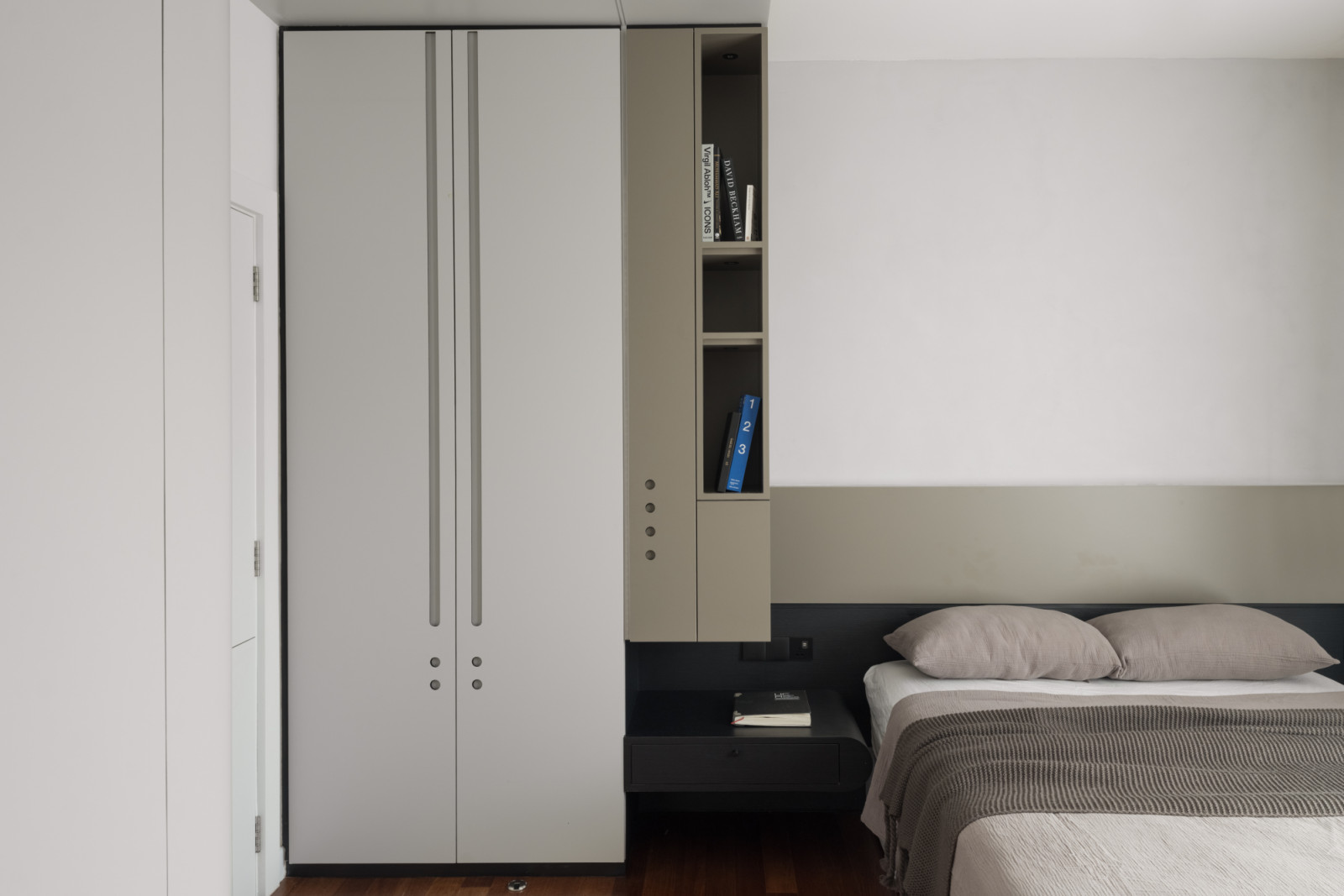 The master bedroom continues the neutral-toned colour scheme, incorporating sustainable materials for soft furnishings