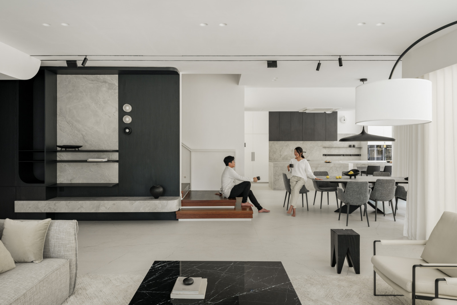 The flowing connection between living and dining areas demonstrates the project's emphasis on functionality harmonising with beauty