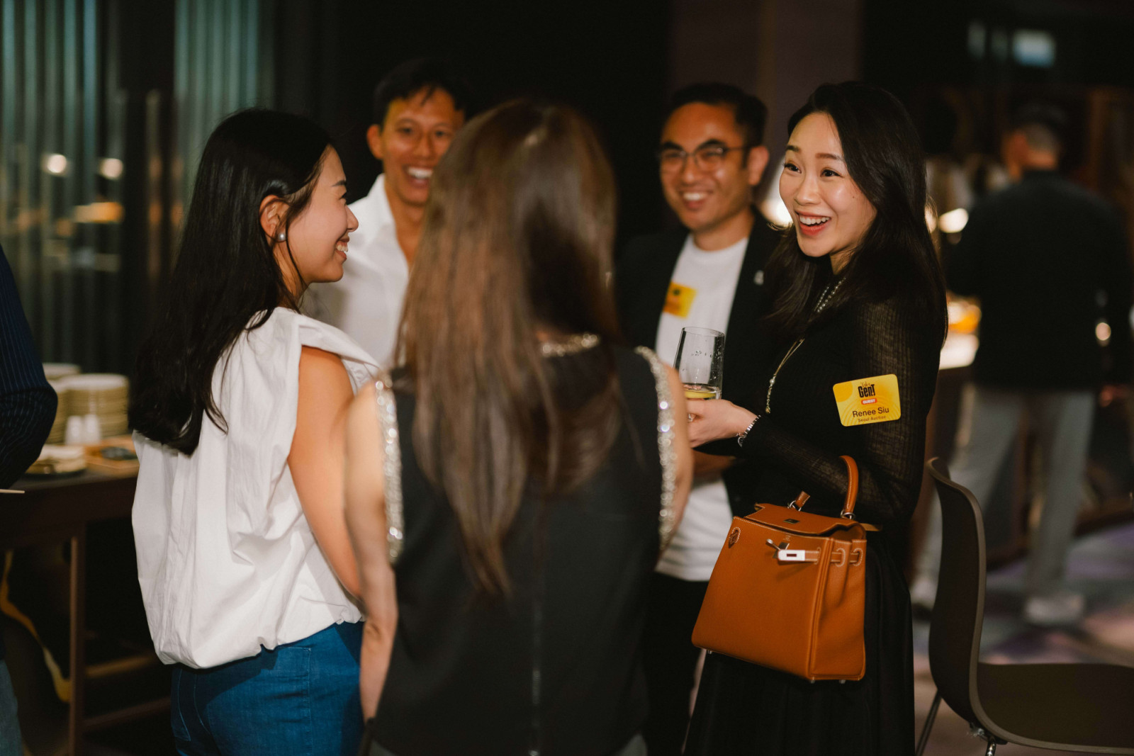 A group of attendees, including Fion Leung, co-founder and CEO of Time Auction, Leo Wong, co-founder and COO of imBee, Aaron Lee, founder and CEO of Dash Living, and Renee Siu, guest of Lee, chat with others (Photo: Jeffrey Hui)