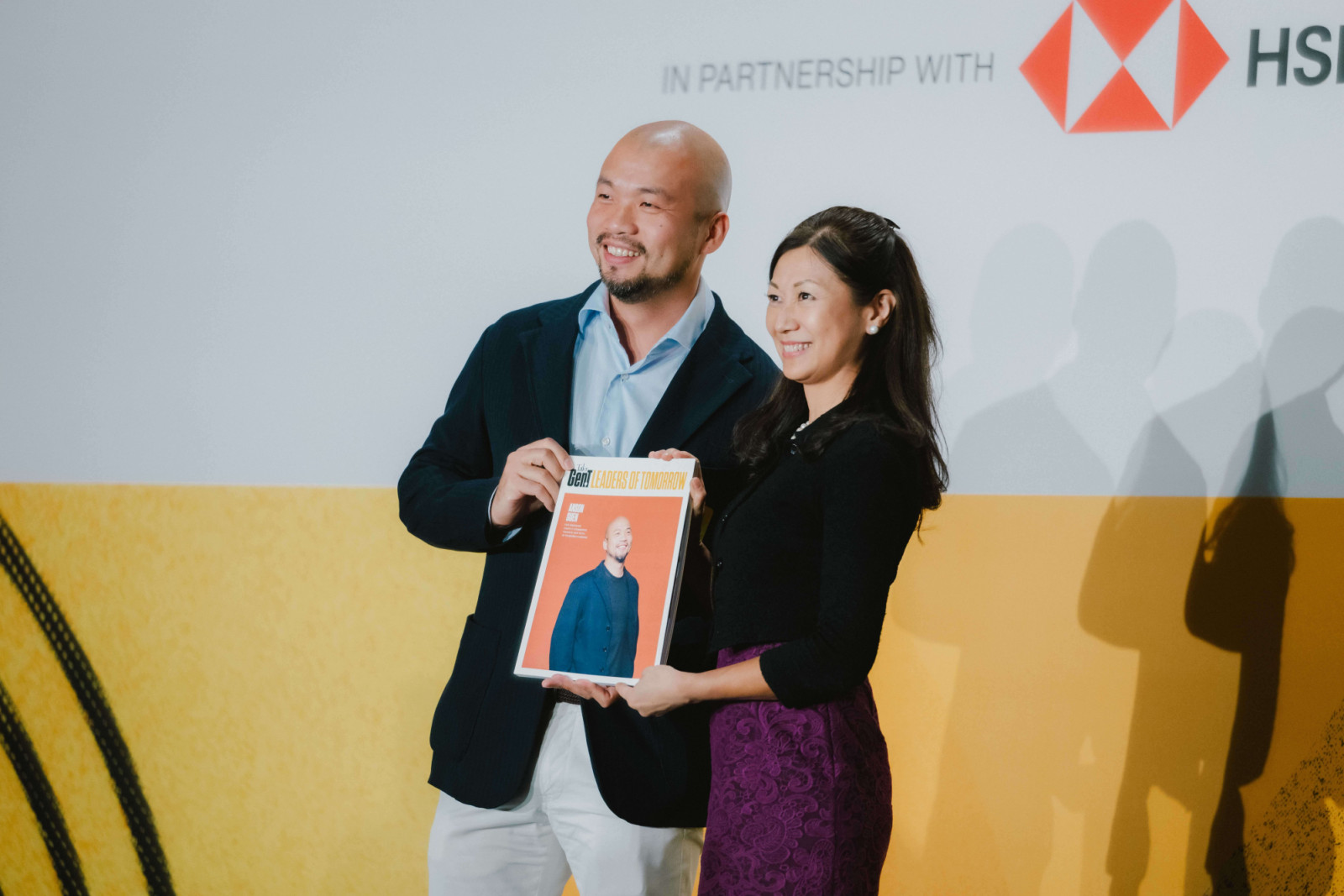 Christina Ong, managing director and head of business banking, Commercial Banking at HSBC, presents Suen, a Gen.T 2025 honouree, with his personalised magazine (Photo: Jeffrey Hui)