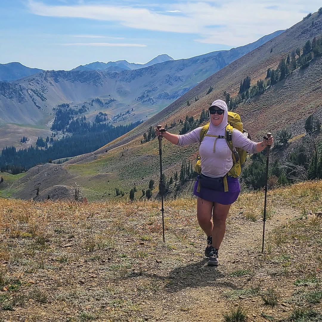 Kathleen Neves, also known as The Hungry Hiker, is a solo backpacker and coach inspiring women to embrace the trail with confidence and practical wisdom.