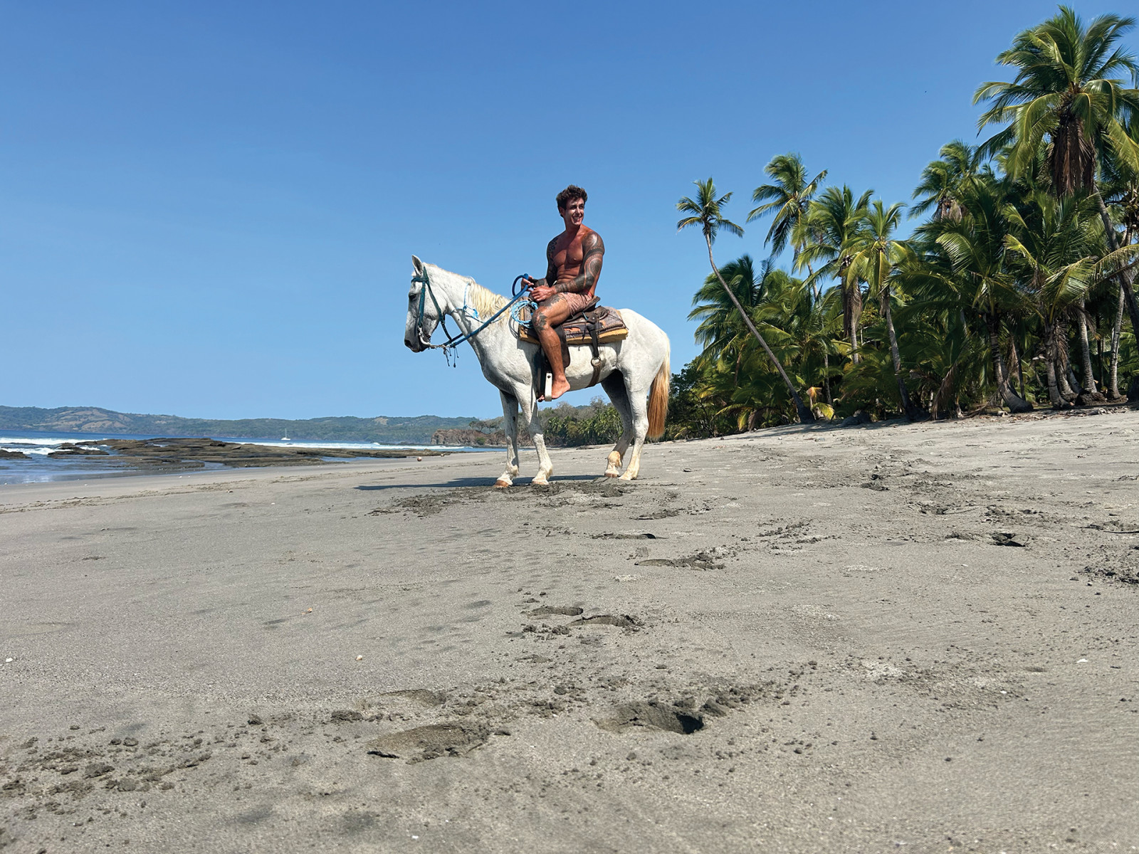 Zobel barefoot riding on a secret beach