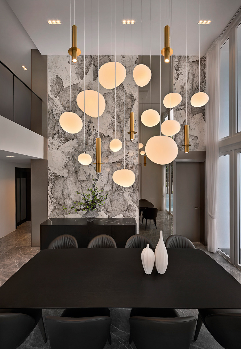 The design team utilised two types of pendant lights to create a dynamic arrangement above