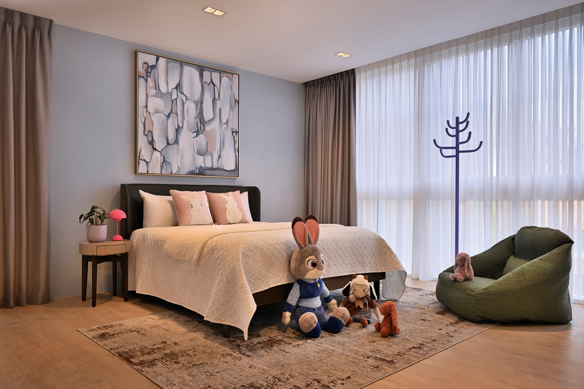 The daughter’s room is dressed in soft pink tones and whimsical details