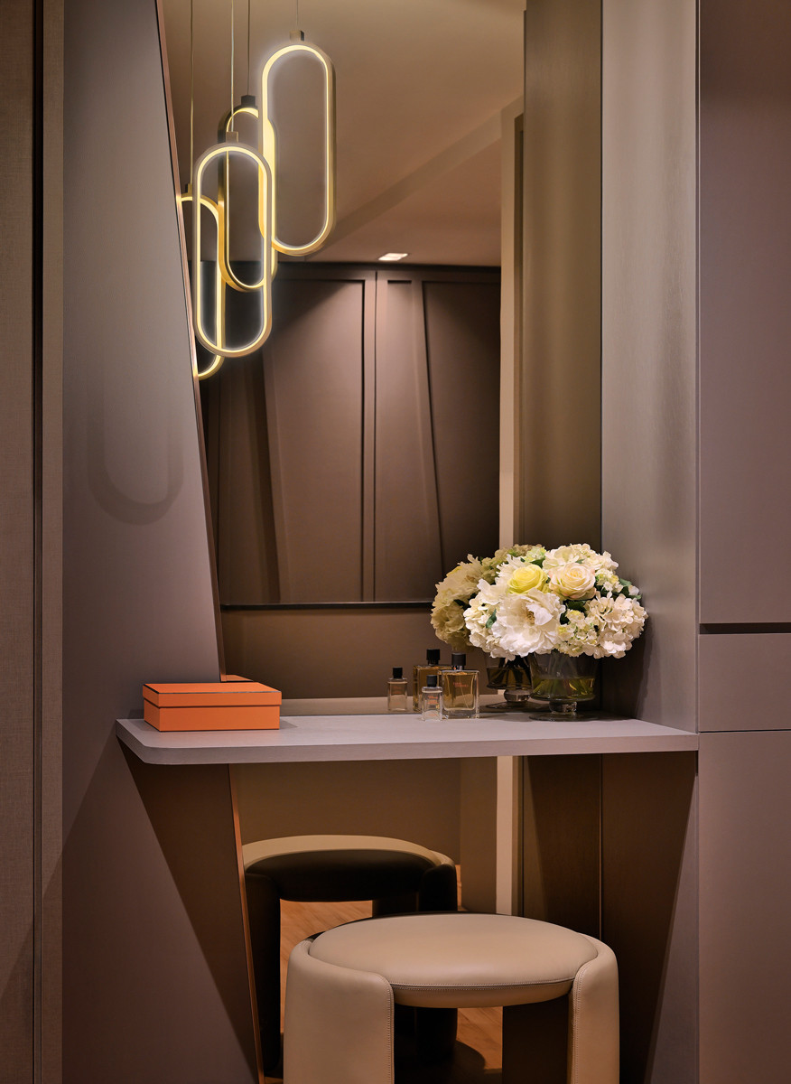 The terrace house’s master suite features a sleek vanity for the wife