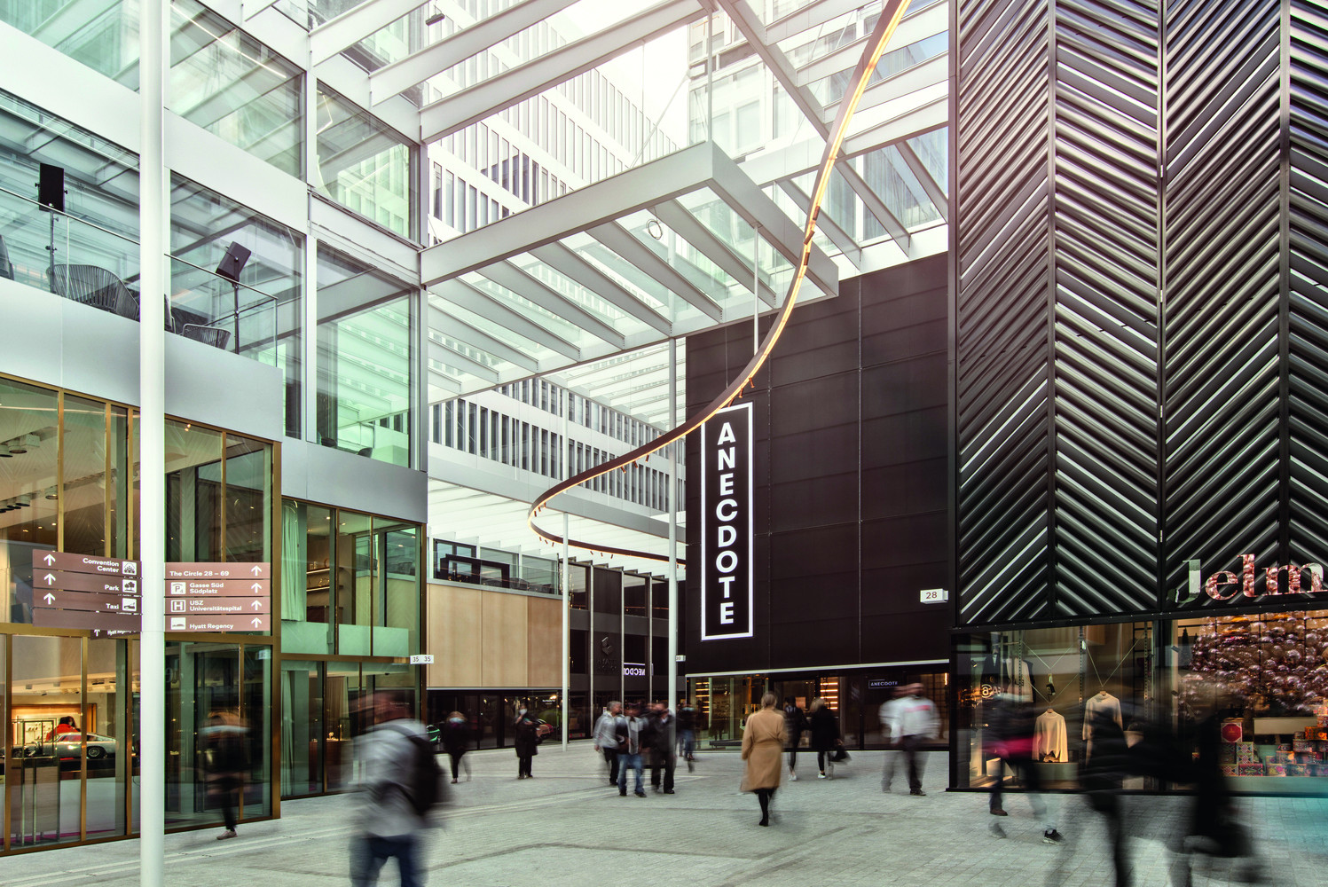 A luminous ribbon guides movement through the central gasse—German for European-style street—that inspired Yamamoto