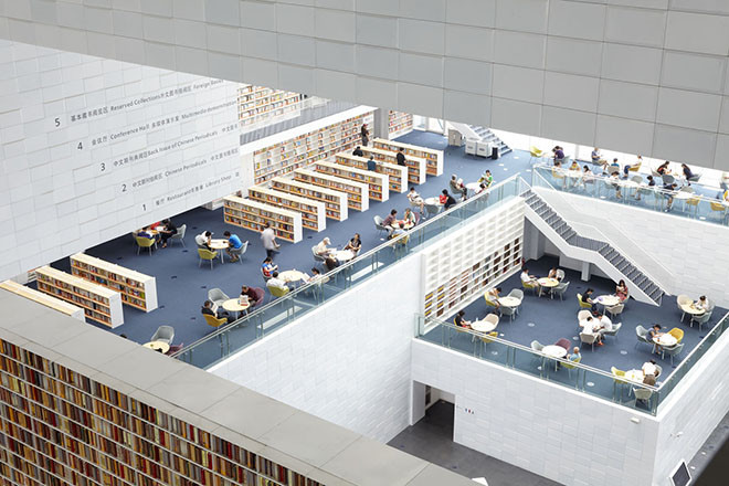 The interior of Riken Yamamoto’s Tianjin Library, which contains five million books neatly shelved into the structure of the building
