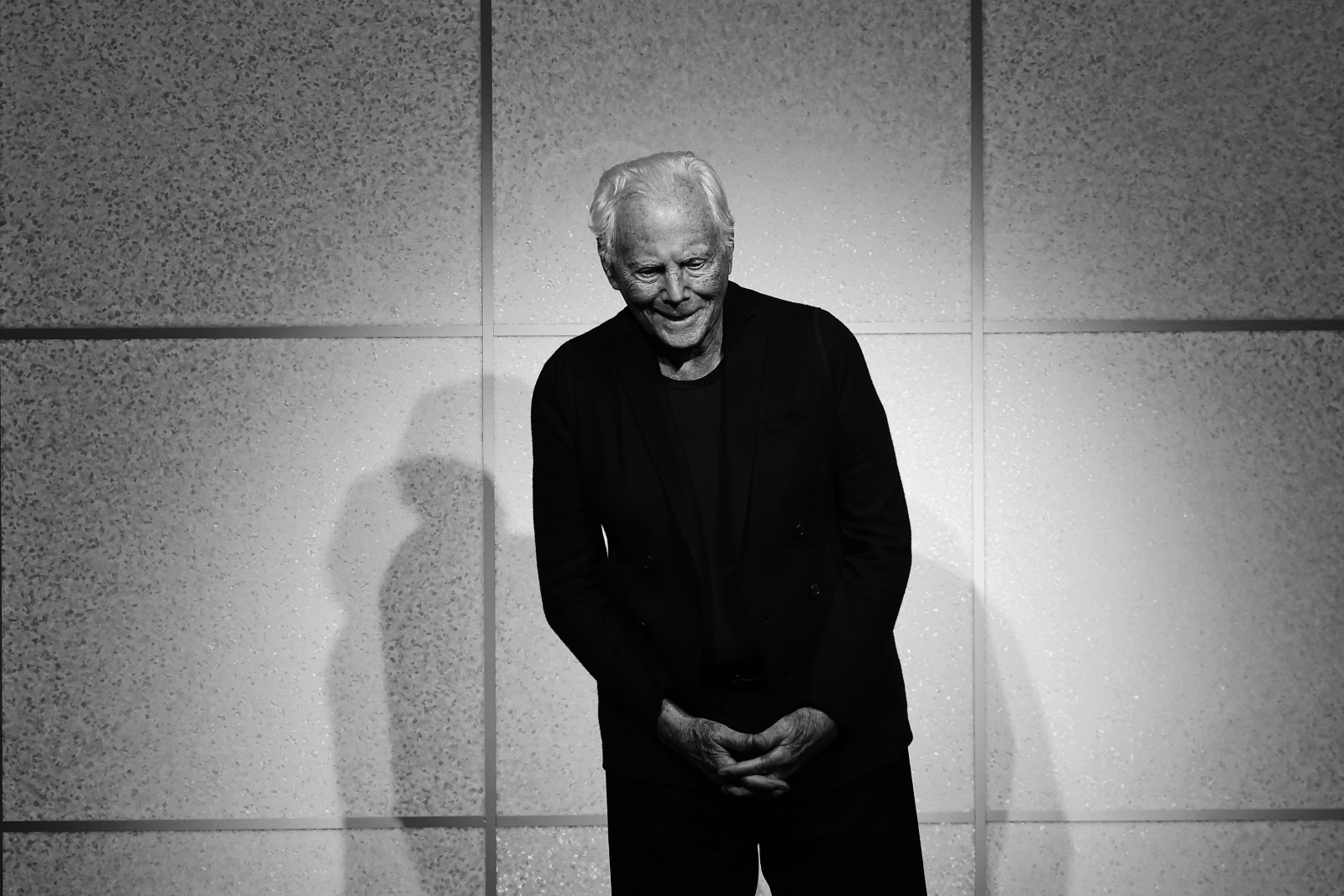 MILAN, ITALY - FEBRUARY 25: (EDITOR NOTE: This image has been converted to black and white) Fashion designer Giorgio Armani acknowledges the applause of the audience at the Giorgio Armani fashion show during the Milan Fashion Week Womenswear Fall/Winter 2024-2025 on February 25, 2024 in Milan, Italy. (Photo by Vittorio Zunino Celotto/Getty Images)