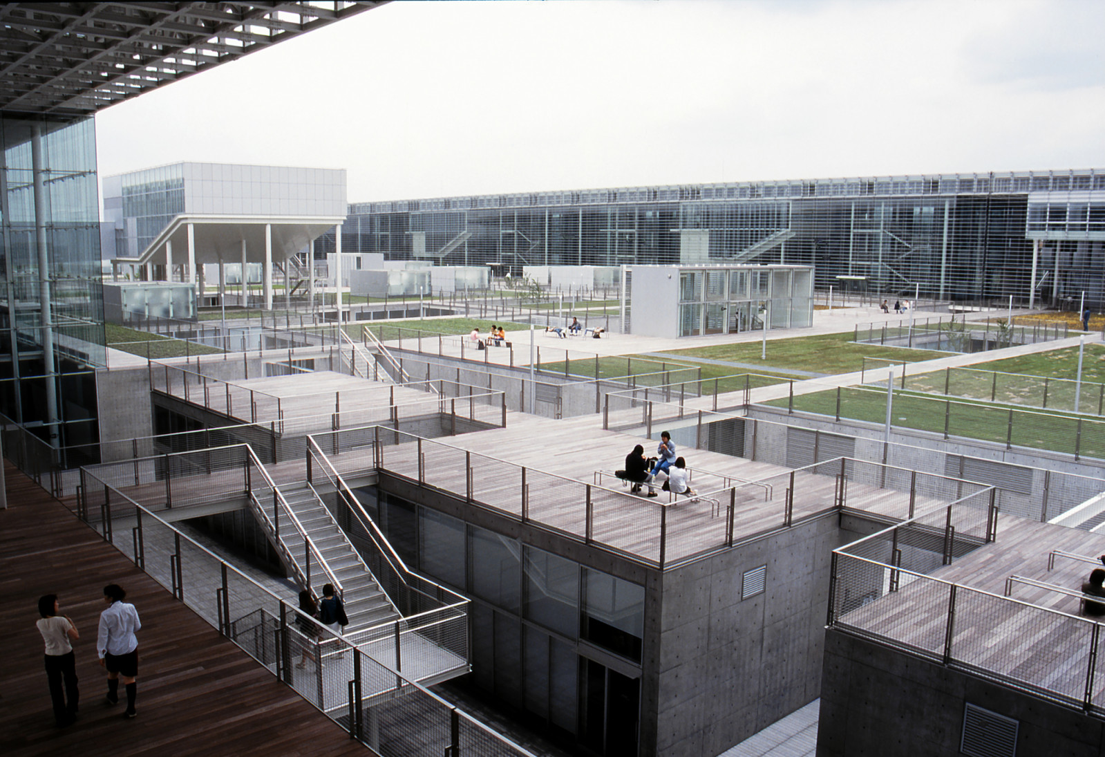 An aerial view of Saitama Prefectural University reveals interconnected rooftops and courtyard