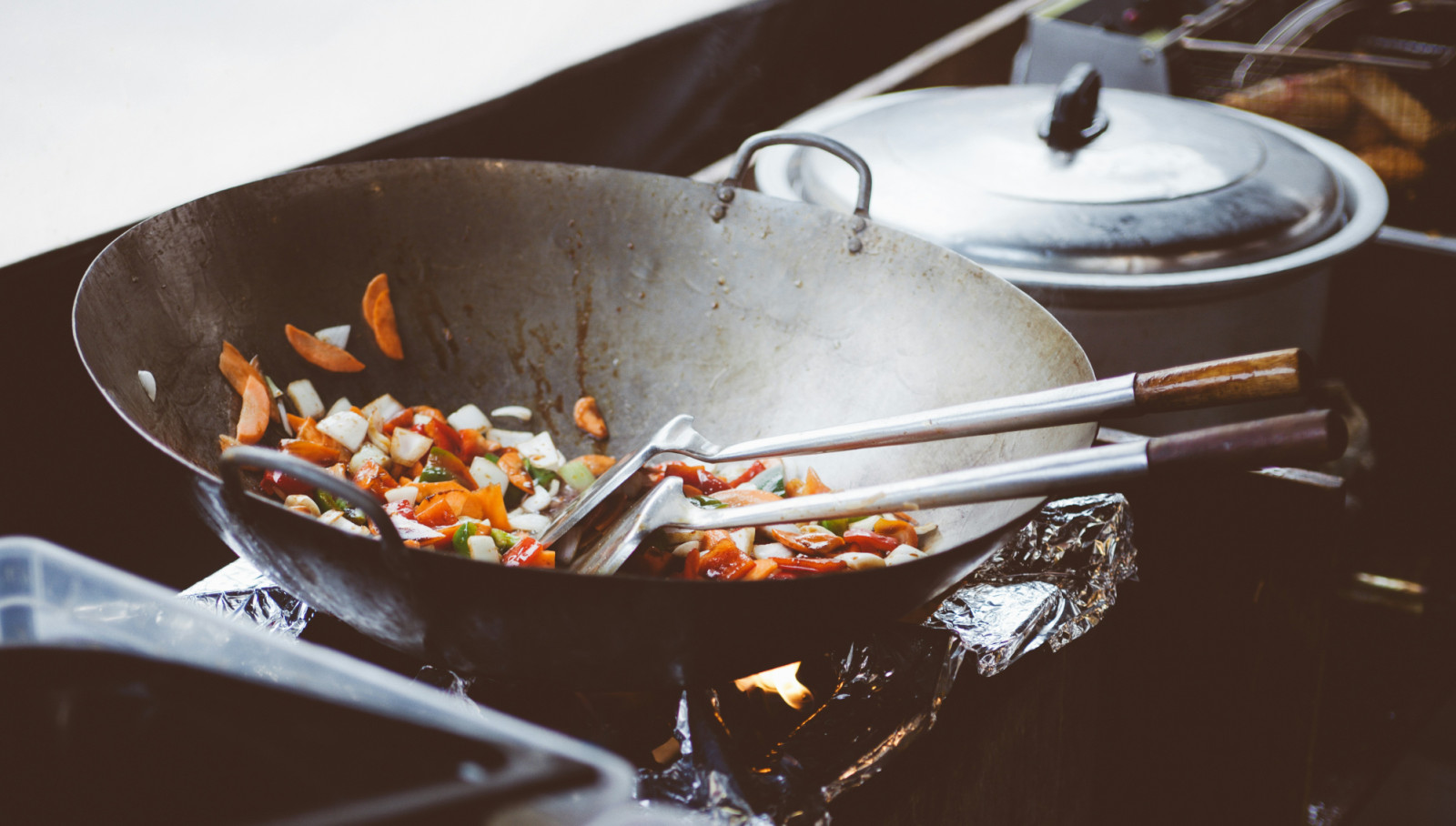 Above: Stoves these days have even been adapted to fit a wok (Photo: Clem Onojeghuo / Unsplash)