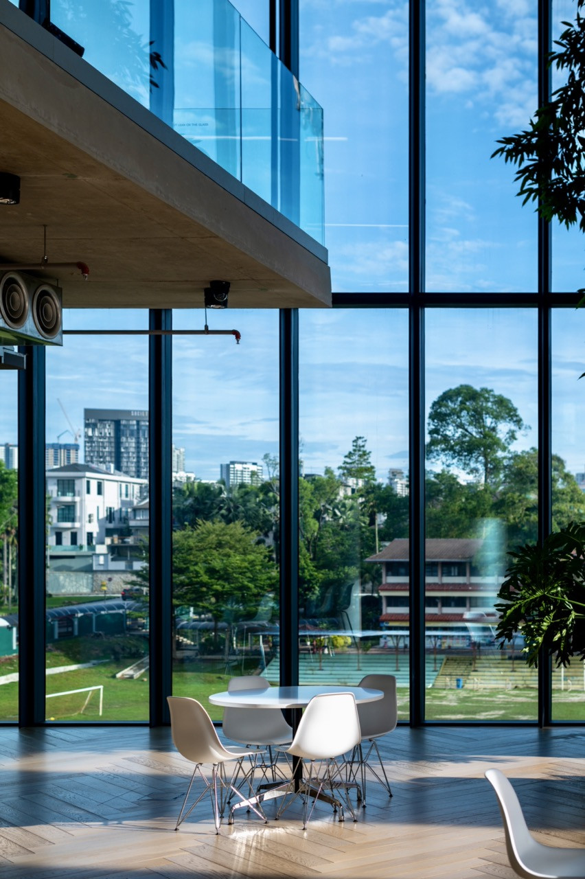 GDP Campus’s double-height spaces and floor-to-ceiling glazing frame views of Bukit Damansara’s evolving neighbourhood, connecting the firm’s workspace to the broader urban context they help shape