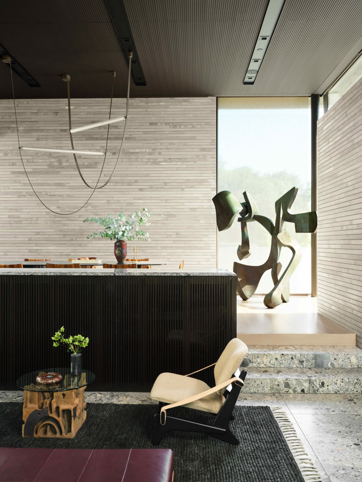 The sunken living space tastefully separated from the dining area