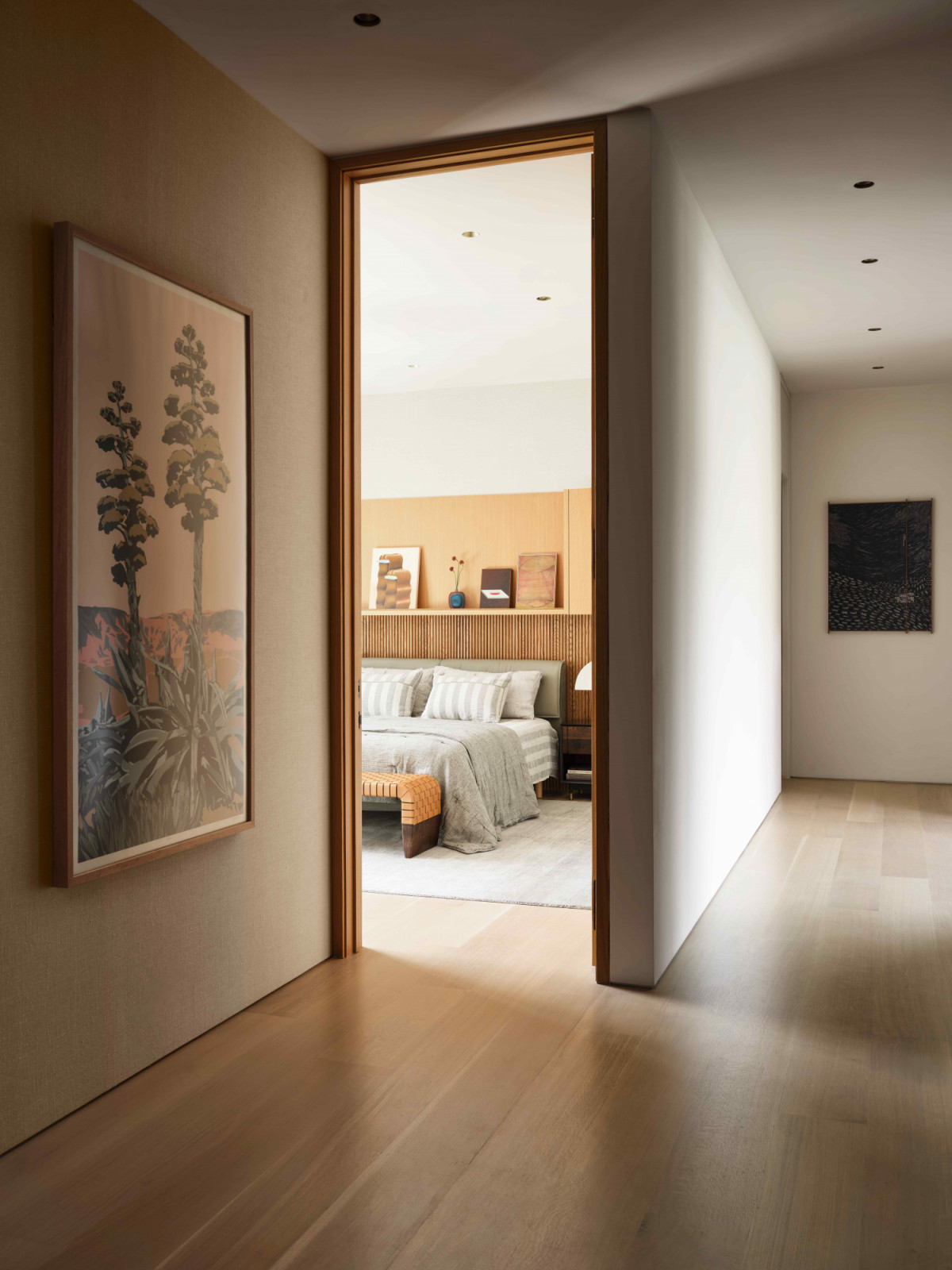 Light oak wide plank flooring offers warmth on the second floor