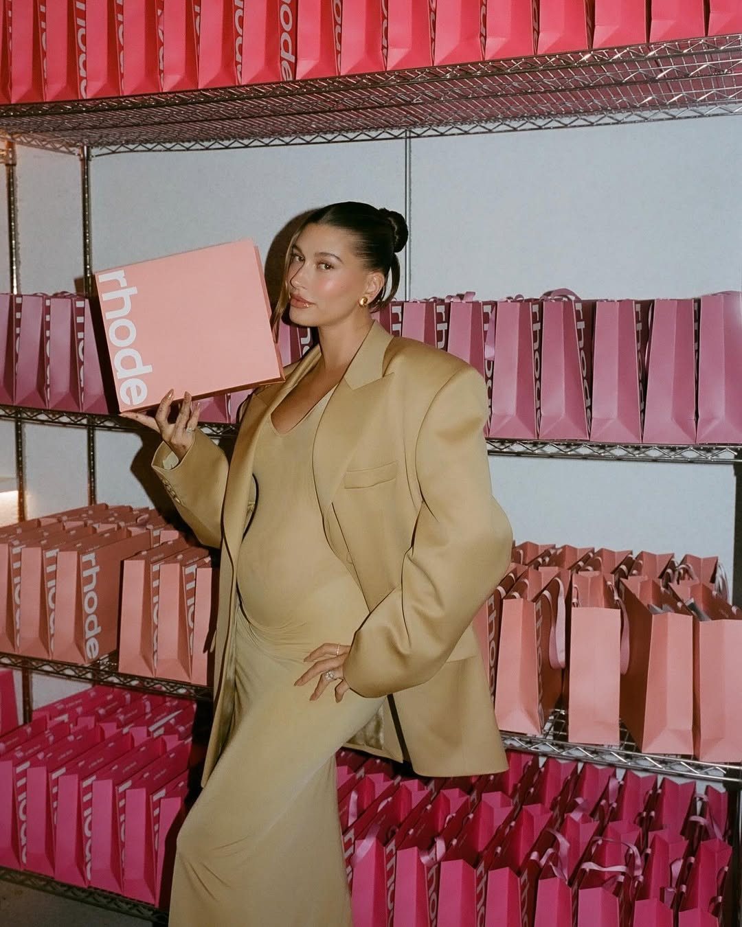 Soft structure tempers the contour of a fitted base—a comfort for moms-to-be. (Photo: Hailey Bieber / Instagram)