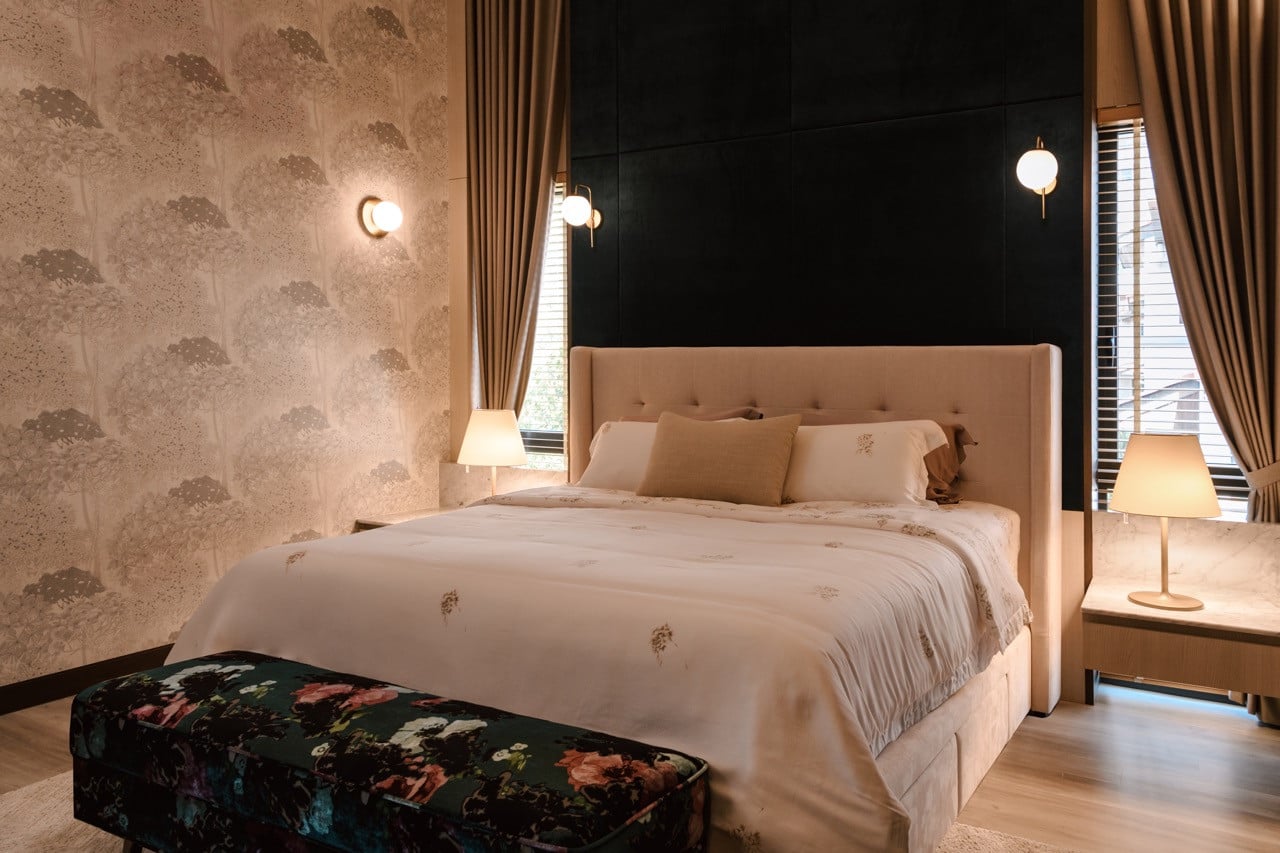 The master bedroom showcases floral wallpaper applied in different background colors, while Melampo bedside table lamps by Artemide provide task lighting