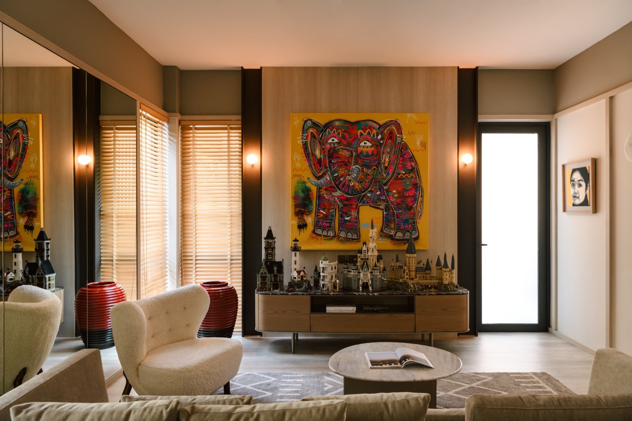 The owner’s eclectic art collection, including colourful elephant artwork and Lego castle models on the Symphony Sideboard by Poliform