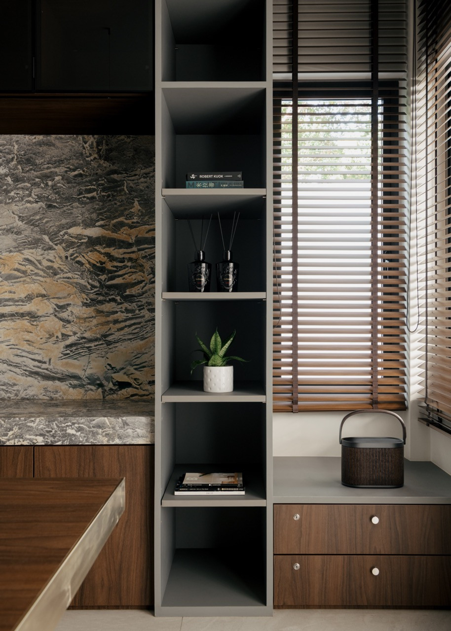 Built-in shelving with Mountain Wave marble backdrop showcases the owner’s collections while maintaining visual restraint through the stone’s subtle landscape-like patterns