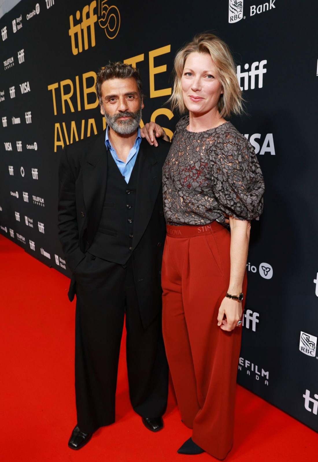 A black three-piece suit, tempered with a splash of brightness (Photo: Getty Images)