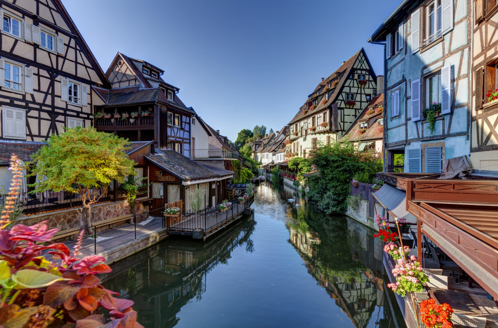 Colmar (north-eastern France): facades of half-timbered houses, traditional Alsatian houses, viewed from the bridge of the street rue de Turenne along the river Lauch, in the tourist district of Little Venice. (Photo by: Godard F/Andia/Universal Images Group via Getty Images)