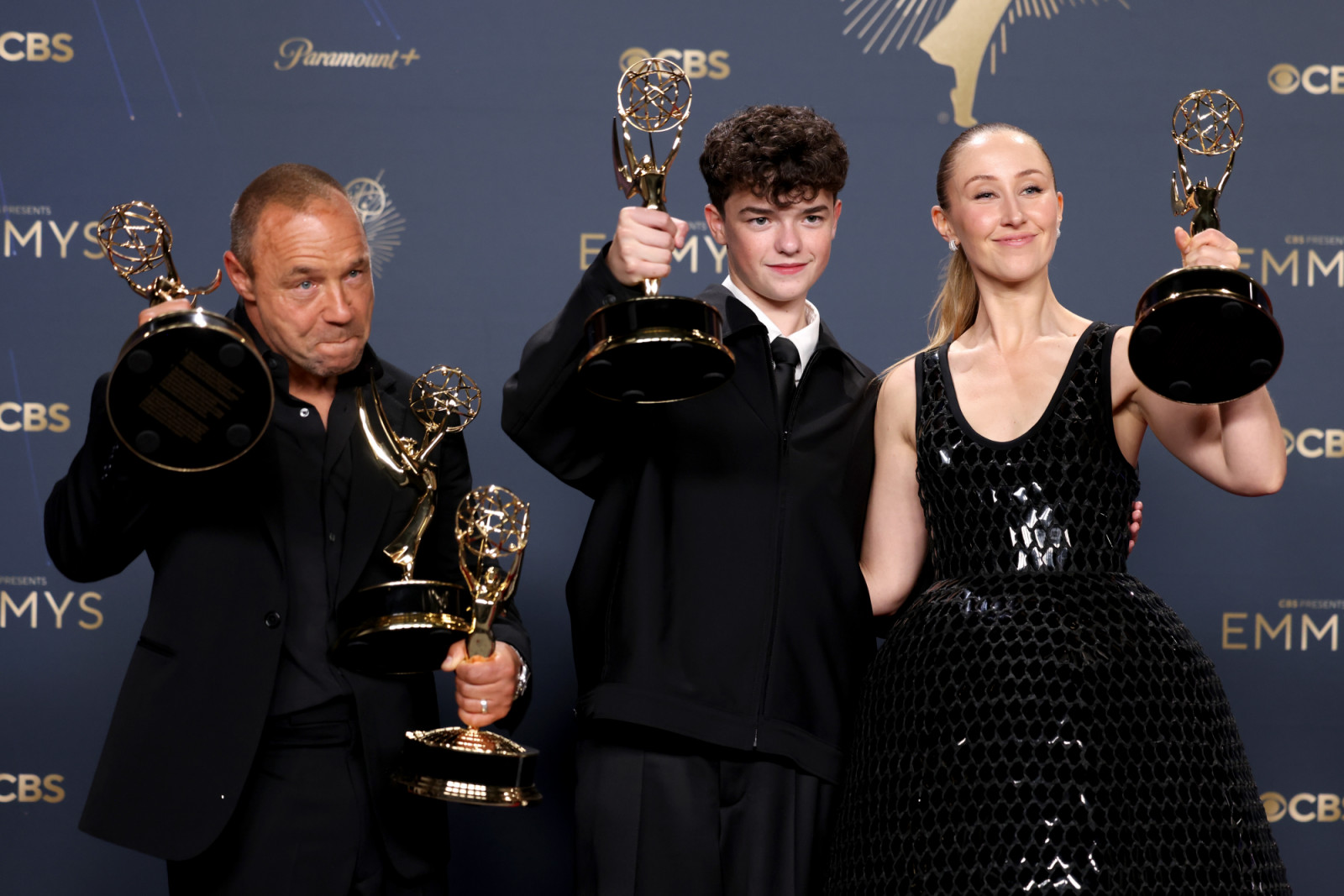 LOS ANGELES, CALIFORNIA - SEPTEMBER 14: (L-R) Stephen Graham, Owen Cooper, and Erin Doherty, winners of Outstanding Limited or Anthology Series, Lead Actor in a Limited or Anthology Series or Movie, Outstanding Supporting Actor in a Limited or Anthology Series or Movie, Outstanding Supporting Actress in a Limited or Anthology Series or Movie, and Outstanding Writing for a Limited or Anthology Series or Movie for "Adolescence," pose in the press room during the 77th Primetime Emmy Awards at Peacock Theater o