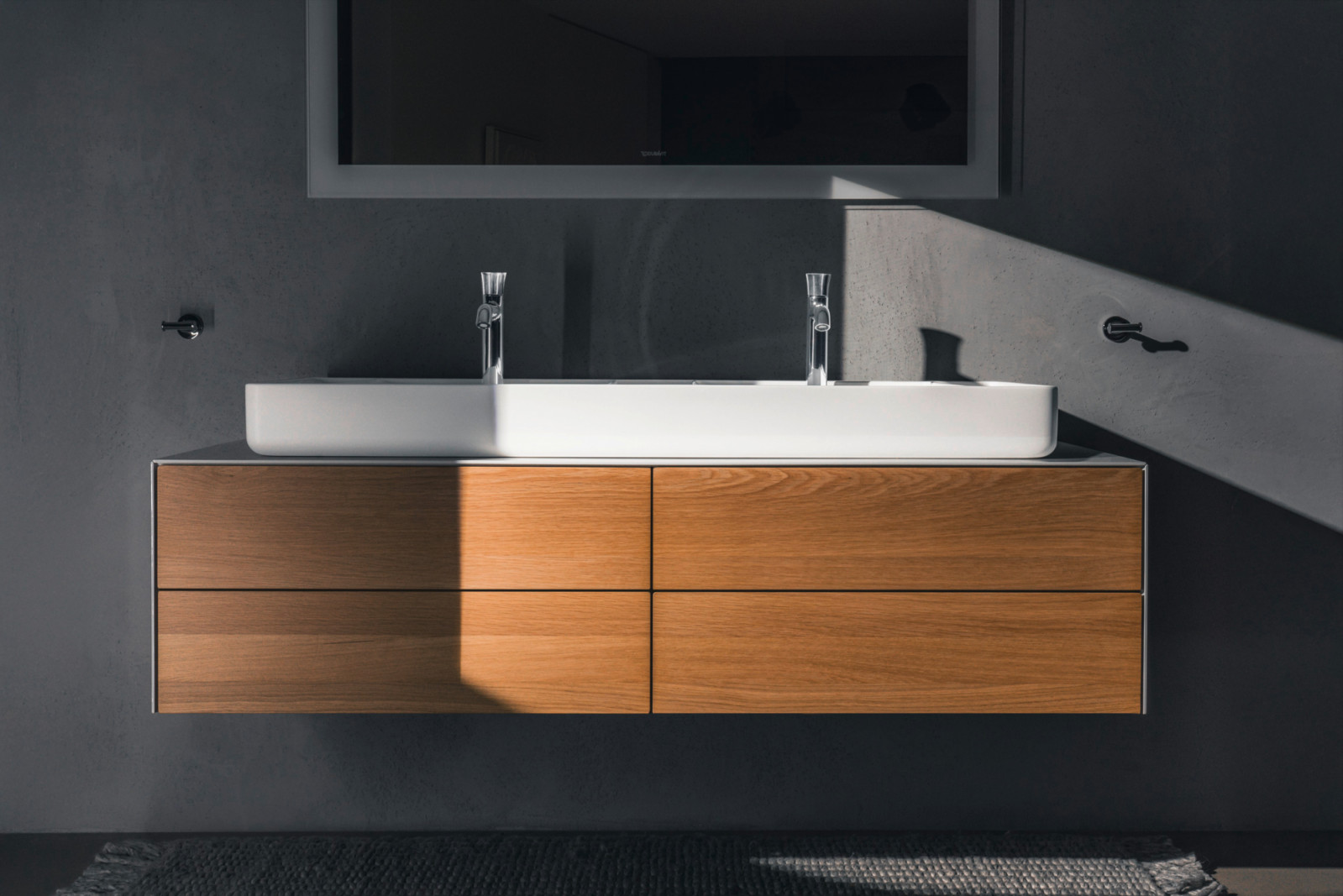 Philippe Starck's White Tulip line, featuring miter-cut edges and paired with the Bento Starck Box furniture washbasin (Photo: Duravit)