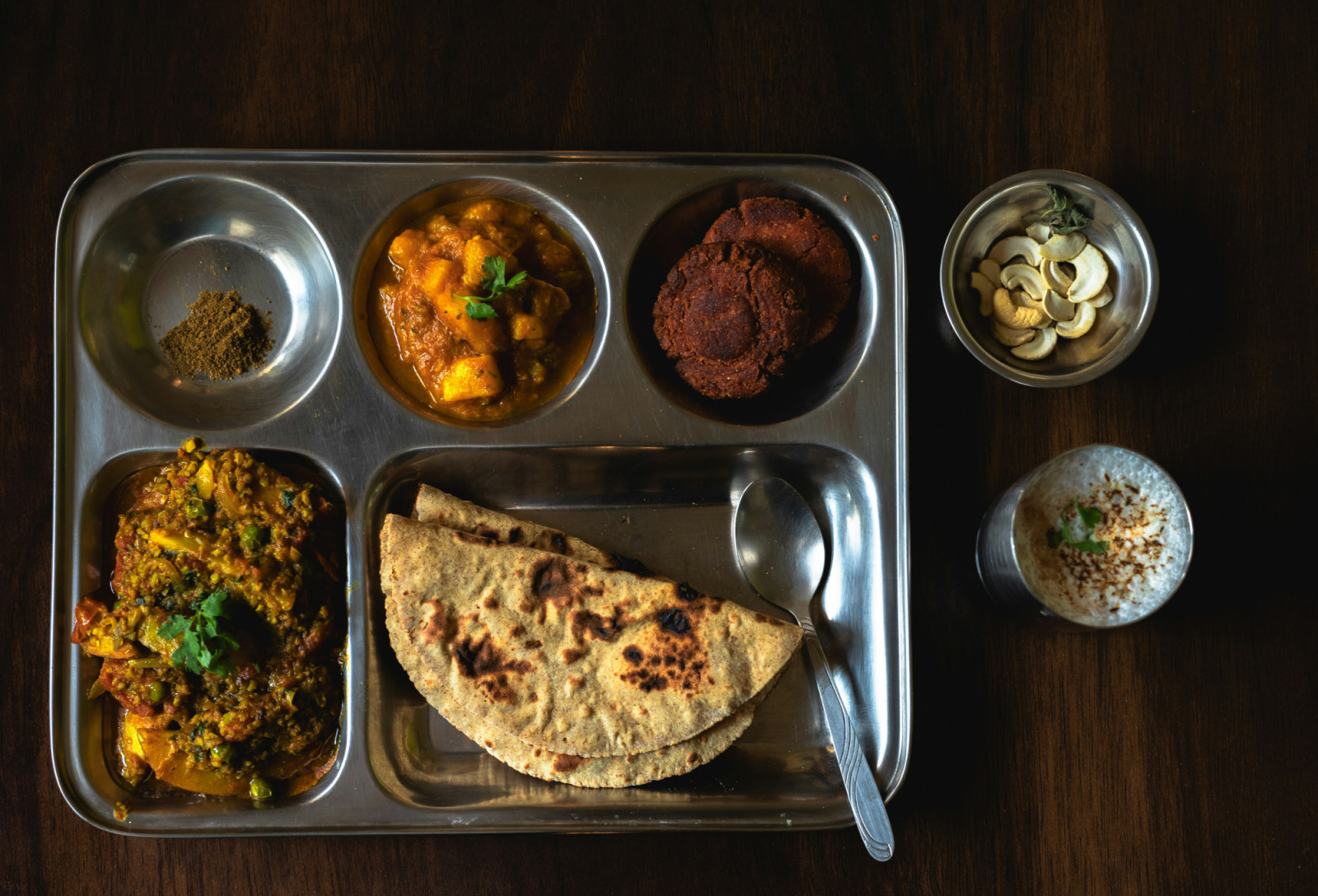 A traditional Indian meal with sides.