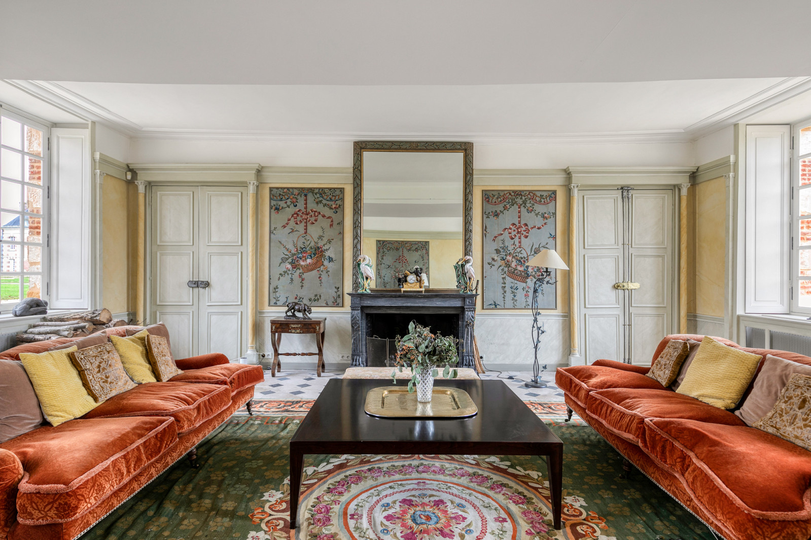 A reception room in the 17-bedroom Normandy château displays period furnishings and decorative elements from the meticulous restoration overseen by France's Architectes des Bâtiments de France