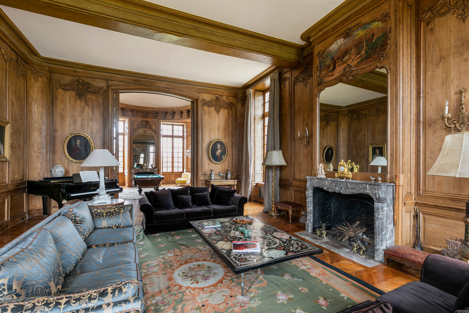 Wood-panelled reception room showcasing the château’s authentic 17th-century architectural details and period craftsmanship typical of the “Grand Siècle” era