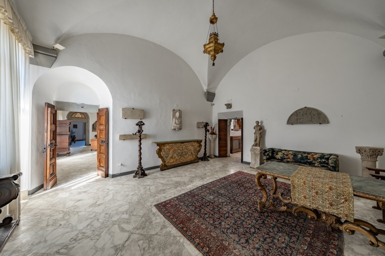 Reception hall inside Castello di Vincigliata featuring classical ribbed vaults and marble floors, part of the 985-square-meter historic European castle dating from 1031 in Fiesole, Florence