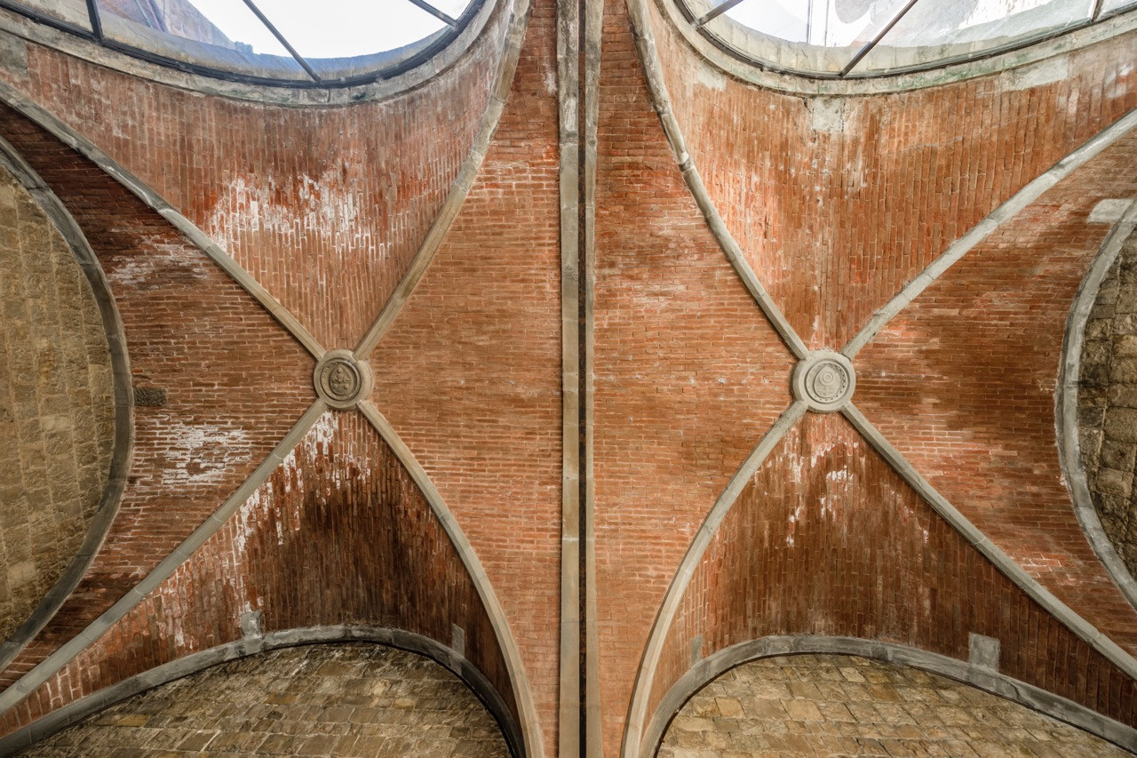 Ribbed vault ceiling detail in Castello di Vincigliata showing original brick and stone construction techniques from the castle's neo-Gothic restoration by architect Giuseppe Fancelli in the 1850s