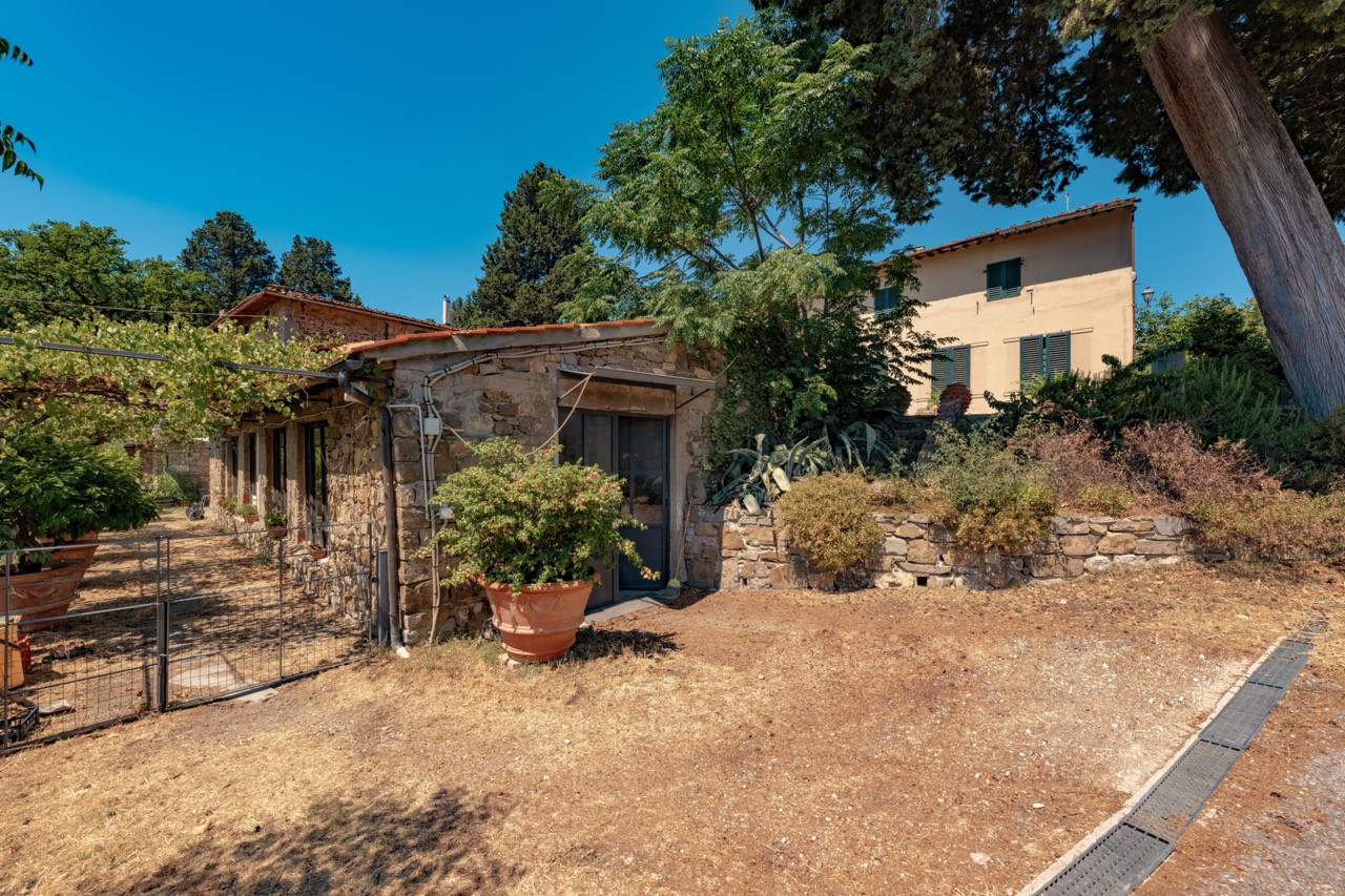 Estate buildings and outbuildings at Castello di Vincigliata including farmhouses and storage areas, representing over 1,100 square meters of additional development potential beyond the main castle