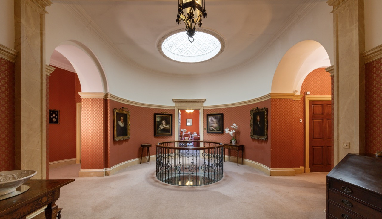 Circular room with portrait gallery at Ripley Castle showing the family heritage displayed throughout this historic European castle that has remained in the same ownership for over seven centuries
