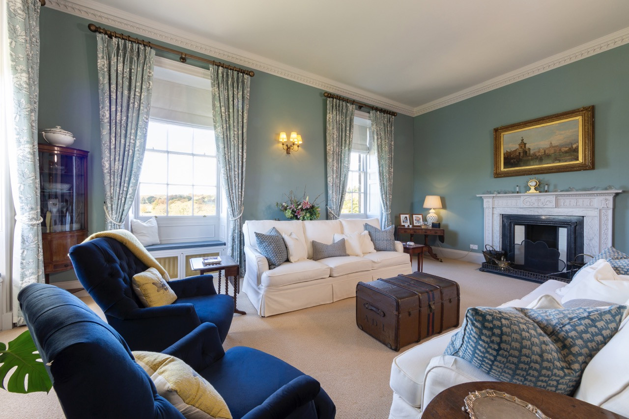 Drawing room with lake views at Ripley Castle, demonstrating the comfortable living spaces within The Castle Apartment’s extensive private accommodation at this historic European castle