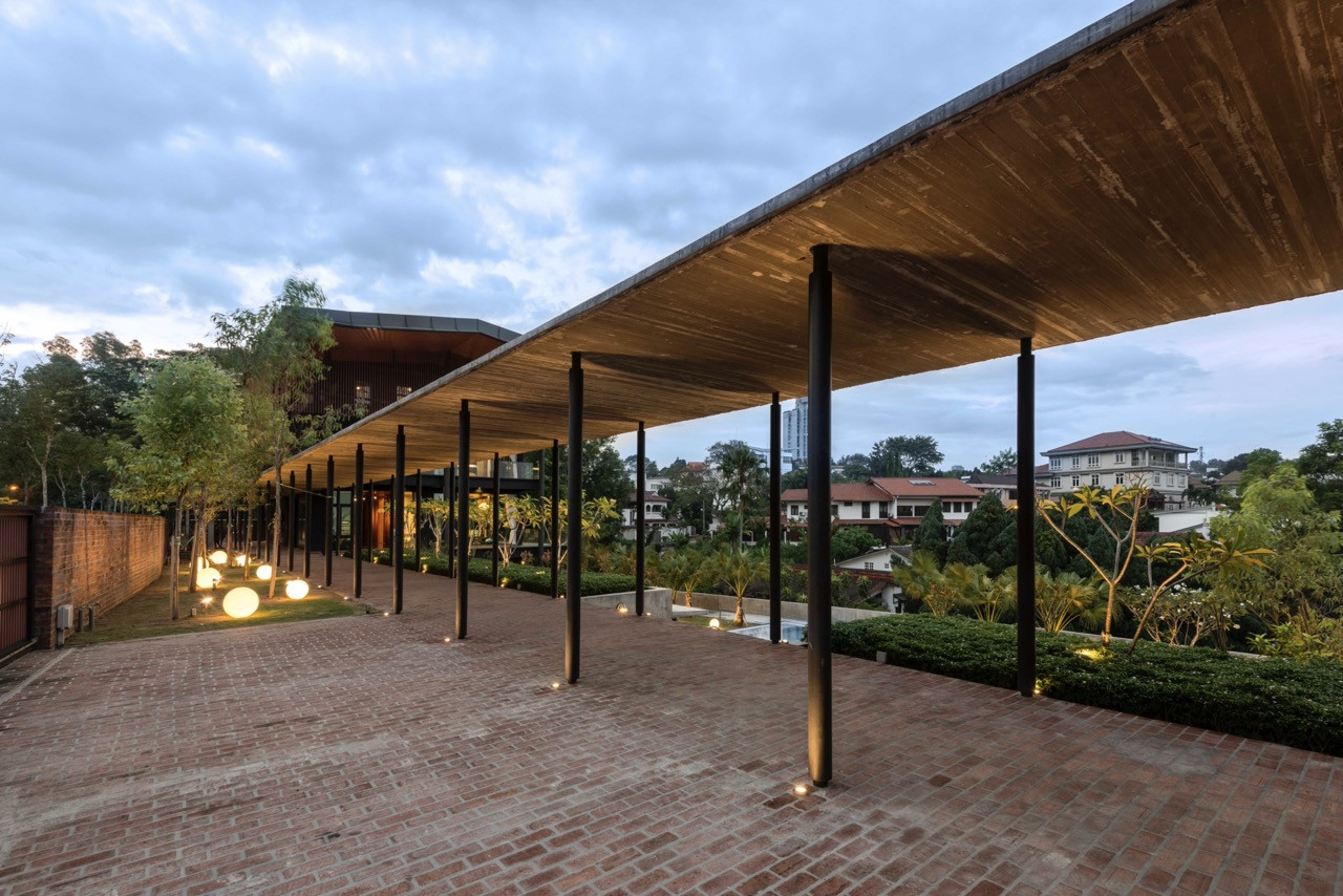 Evening view along verandah towards Damansara Heights, with spherical lighting elements