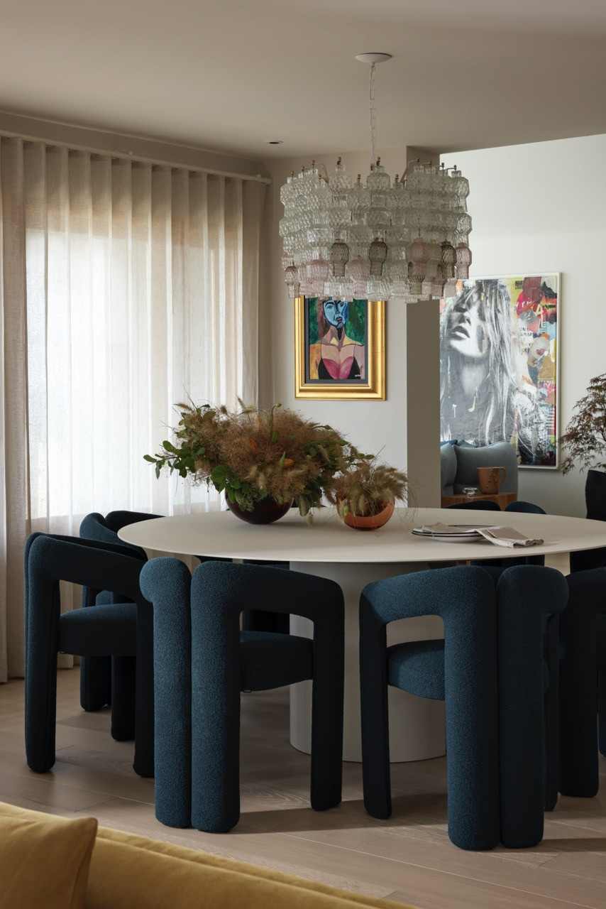 The dining area features vintage Murano glass chandeliers and 562 Dudet dining chairs by Cassina, with the NVL table by MDF Italia and glass vessels by Jemma Van Osch