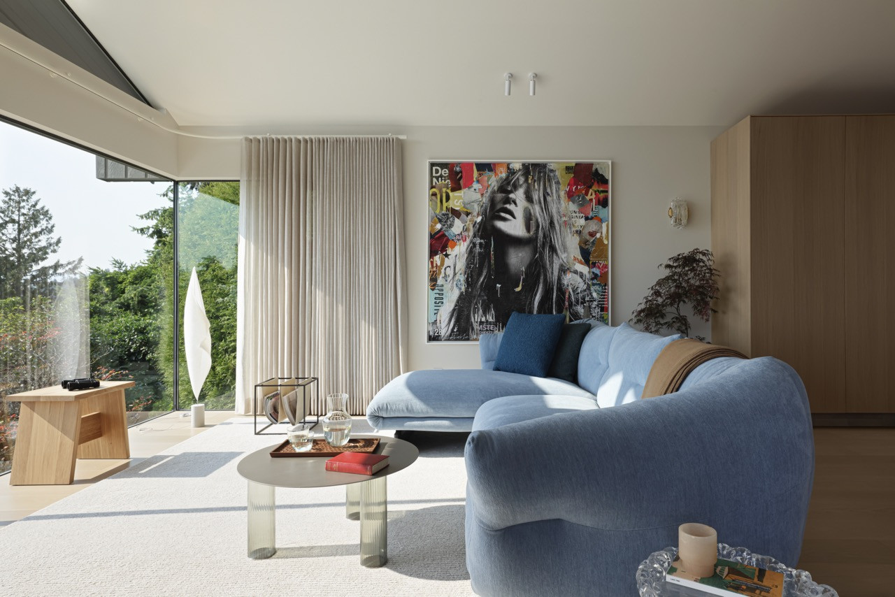 The family room features the Moncloud sectional by Cassina, demonstrating how contemporary art and sculptural furnishings work together in the gallery-like setting that celebrates the owner's collection