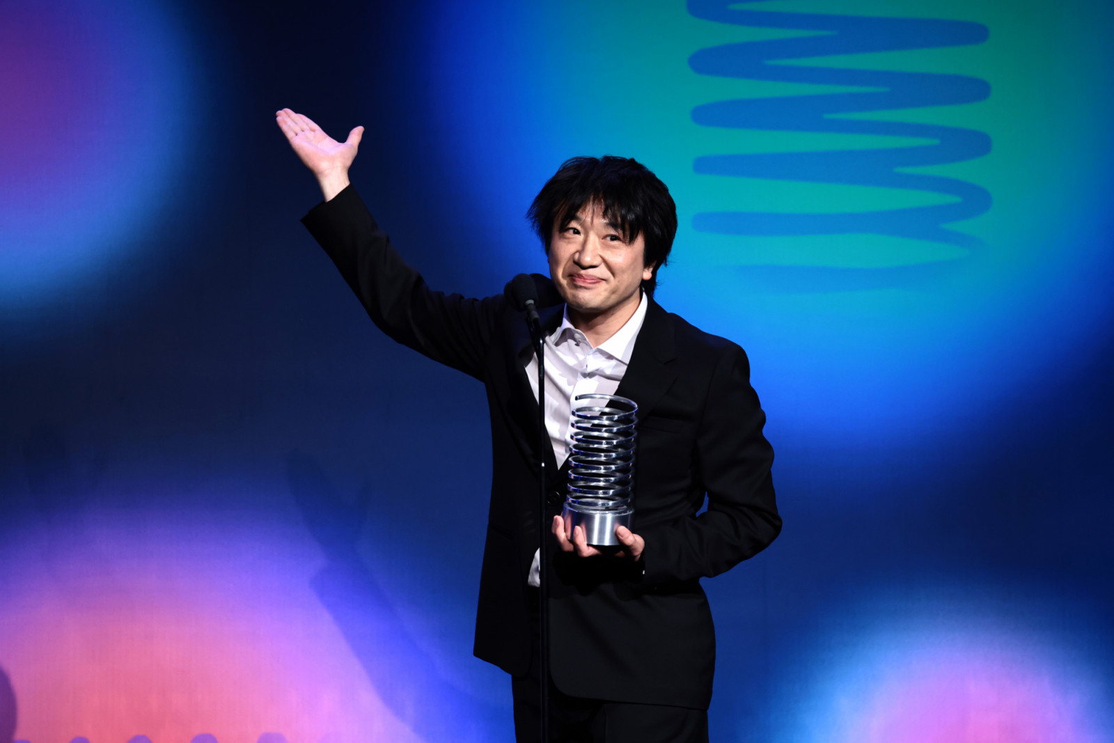 Japanese designer Shigetaka Kurita speaks onstage at the 27th Annual Webby Awards in New York (Photo: Getty Images)