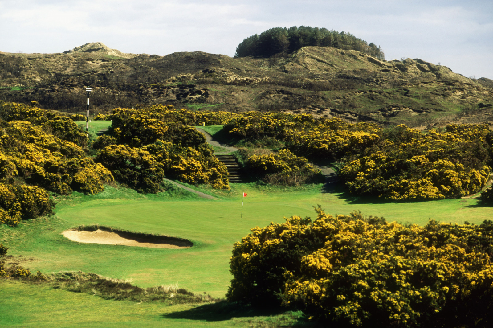 NEWCASTLE - JULY 28: General view of the 13th Green at the Royal County Down Golf Course taken during the 2001 Senior British Open on July 28, 2001 in Newcastle, Ireland. (Photo by David Cannon/Getty Images)