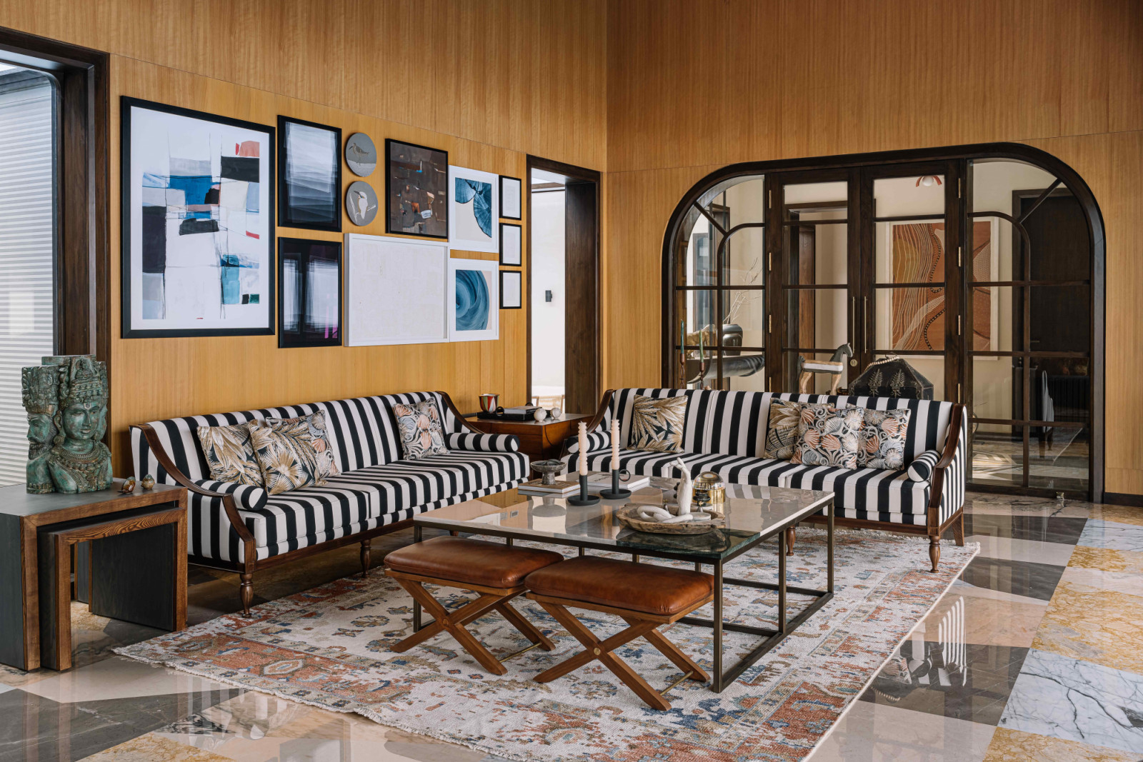 Marble flooring in the living room radiates quiet luxury
