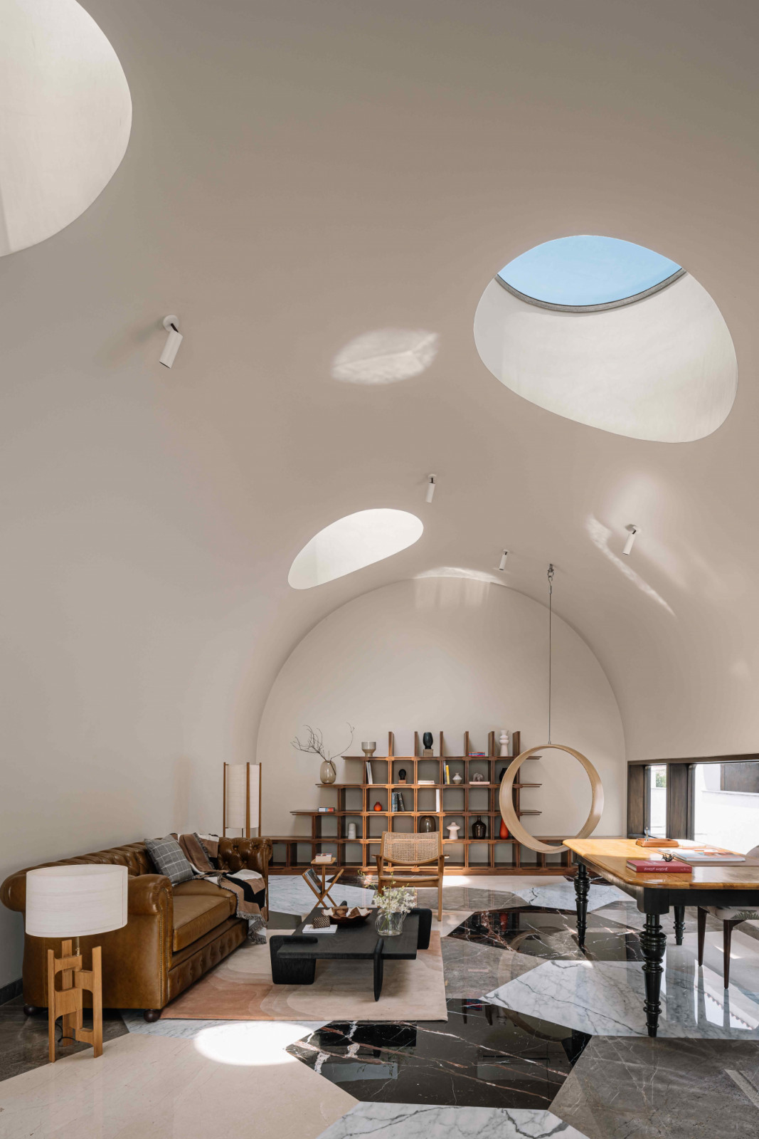 Light filtering into the library through oculus skylights